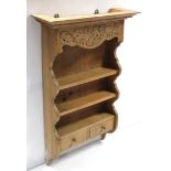 A set of carved pine three-tier open wall shelves, fitted two small drawers to the lower tier & with