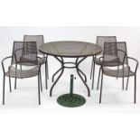 A bronzed wrought-metal garden table with circular top, & on four shaped legs, 42” diameter; a ditto