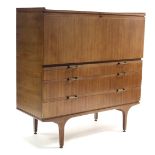 A mid-20th century teak side cabinet, with fitted interior enclosed by fall-front above two