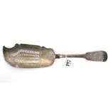 A late Victorian silver fiddle pattern fish server, 11¼” long, London 1900.
