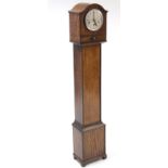 A mid-20th century grandmother clock with chiming movement, & in oak case, 52¼” high.