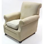 A Georgian-style armchair, upholstered cream material & on bun feet.