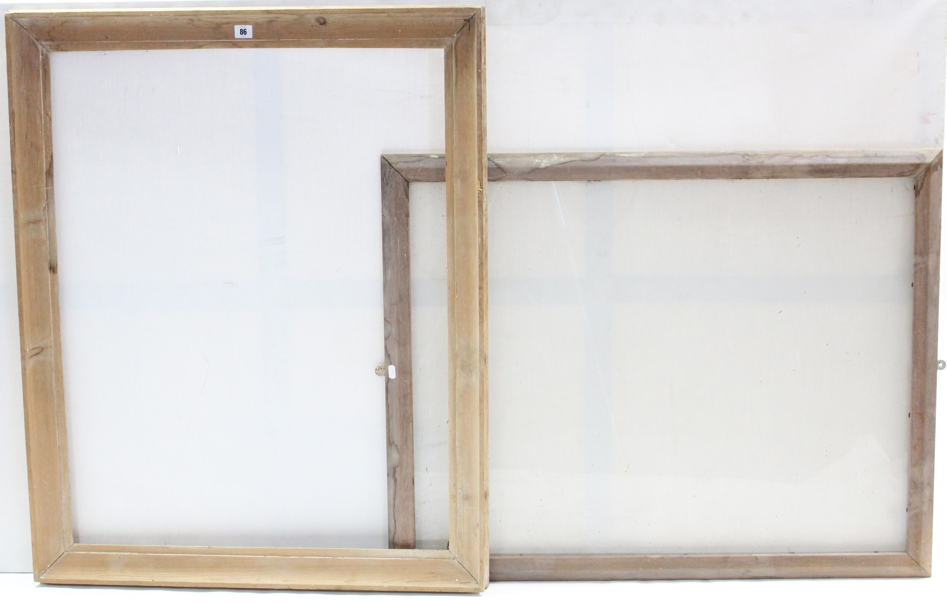 An early/mid-20th century pine picture frame, 36” x 28½” (internal size); & another wooden picture