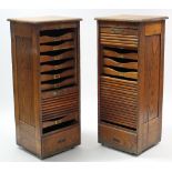 A pair of late 19th/early 20th century oak upright office filing cabinets each fitted ten sliding