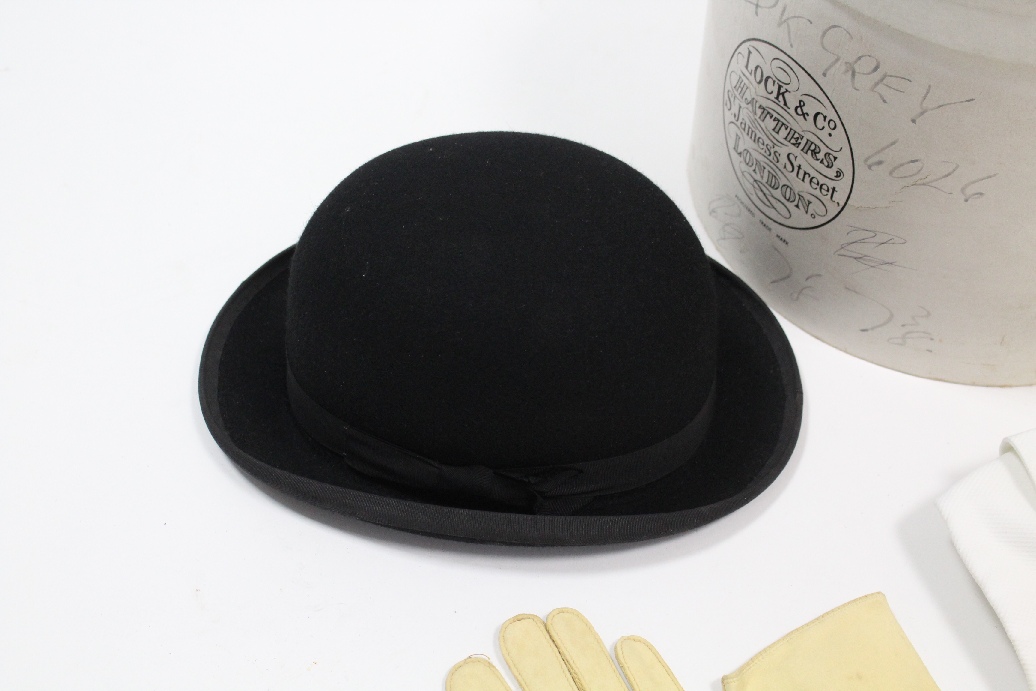 A Lock & Co. London black felt bowler hat with cardboard hatbox; a pair of kid leather gloves; two - Image 2 of 7