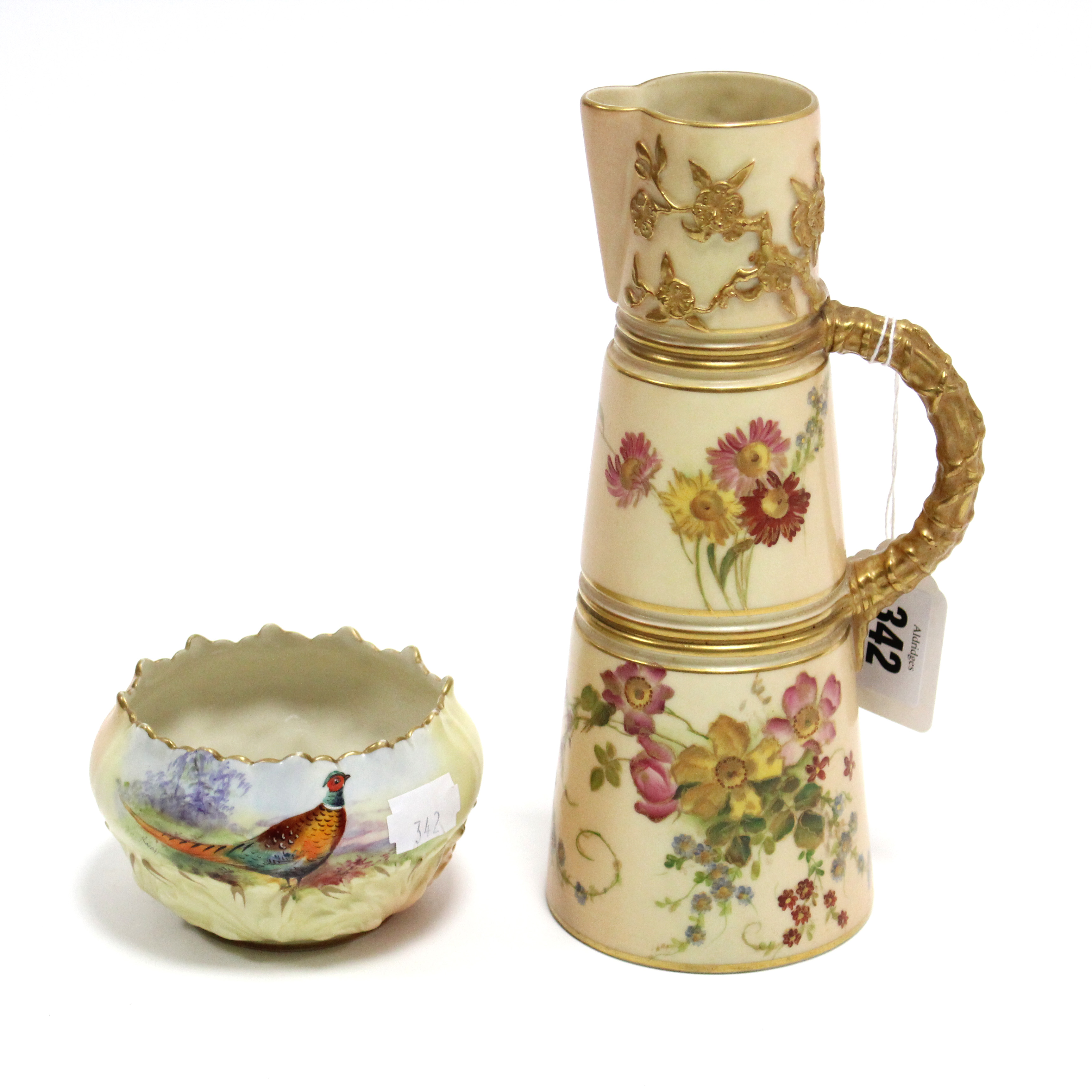 An early 20th century Royal Worcester porcelain ewer of round tapered form & with bright-coloured