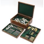 A Mappin & Webb oak canteen containing various items of plated & stainless steel cutlery.