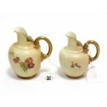 Two late 19th/early 20th century Royal Worcester porcelain globular jugs, each with painted floral