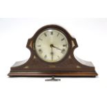 An Edwardian mantel clock with silvered dial, chiming movement, & in inlaid-mahogany case, 9½”