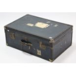 A blue fibre-covered travelling trunk, with hinged lift-lid, 30” wide.