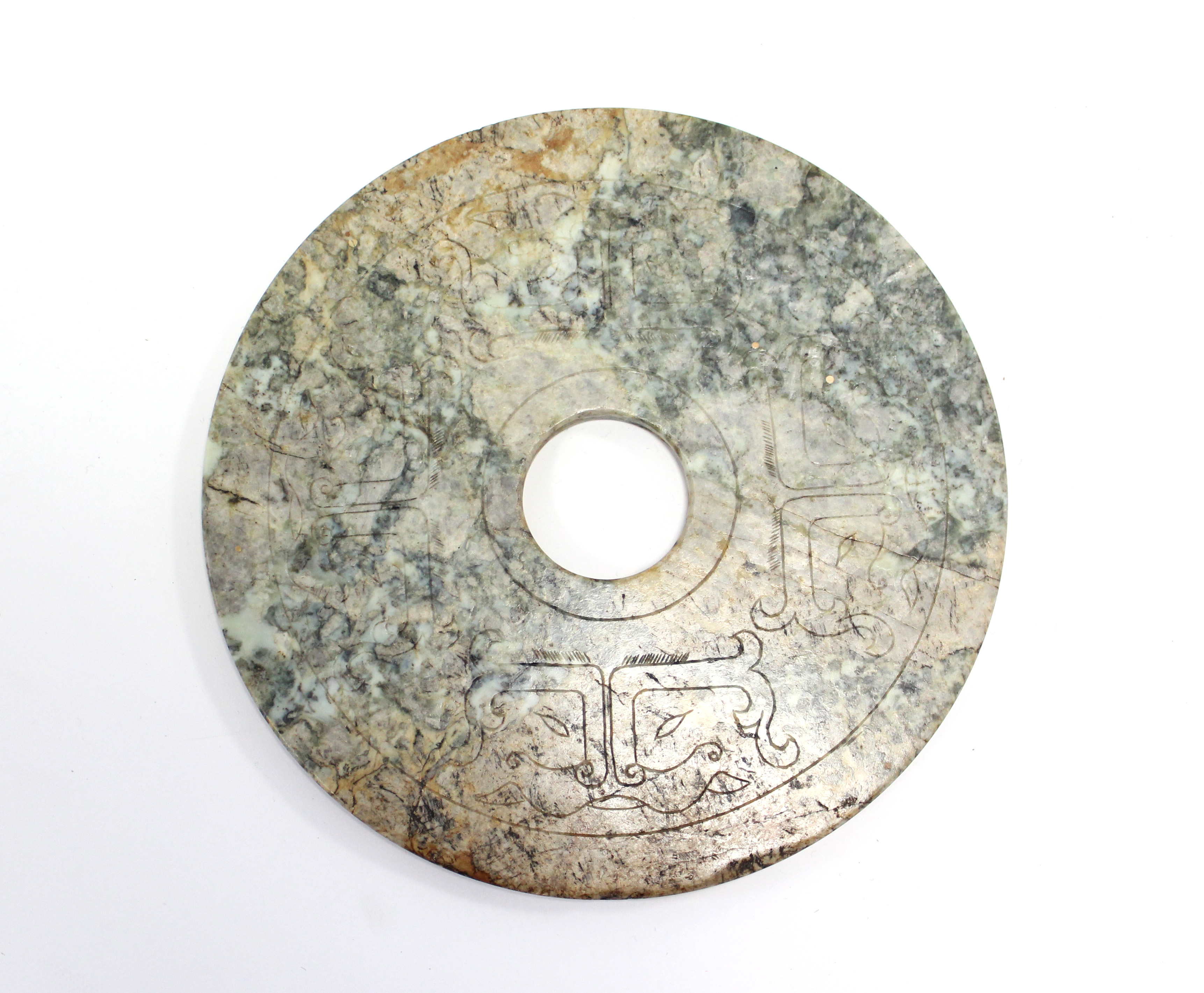 A CHINESE ARCHAISTIC CARVED JADE DISC (BI), the stone of mottled green, russet, & grey tone, the - Image 3 of 3