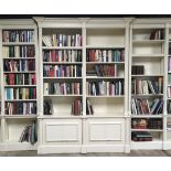 *Amended Descriprtion* A BESPOKE SUITE OF GEORGIAN-STYLE LIBRARY BOOKCASES designed to surround