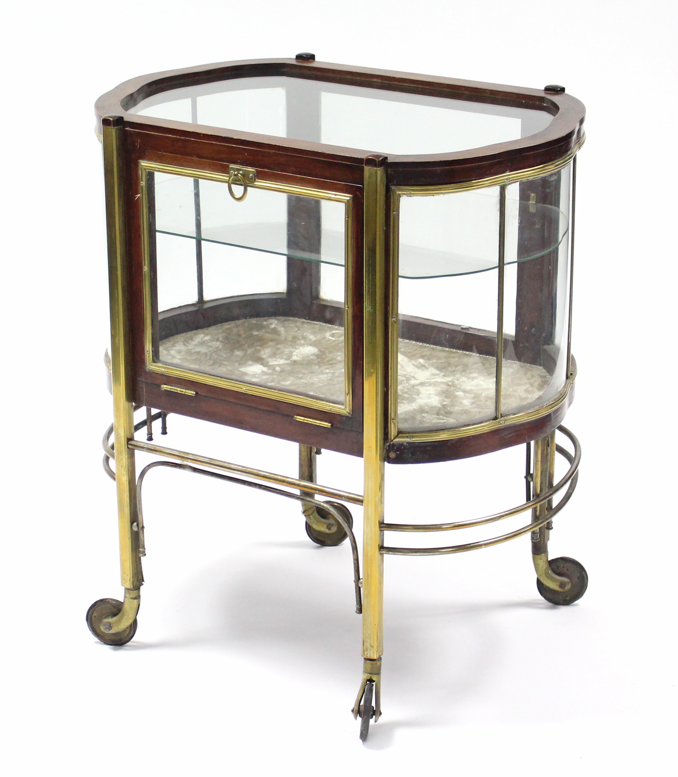 An Edwardian mahogany & brass-mounted trolley with glazed top & sides, fitted single shelf, on brass