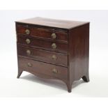 A late 18th century mahogany chest with crossbanded top, fitted brushing slide above four long