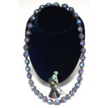 A Chinese necklace of pierced silver, blue & turquoise enamel oval beads; & an enamelled model of an