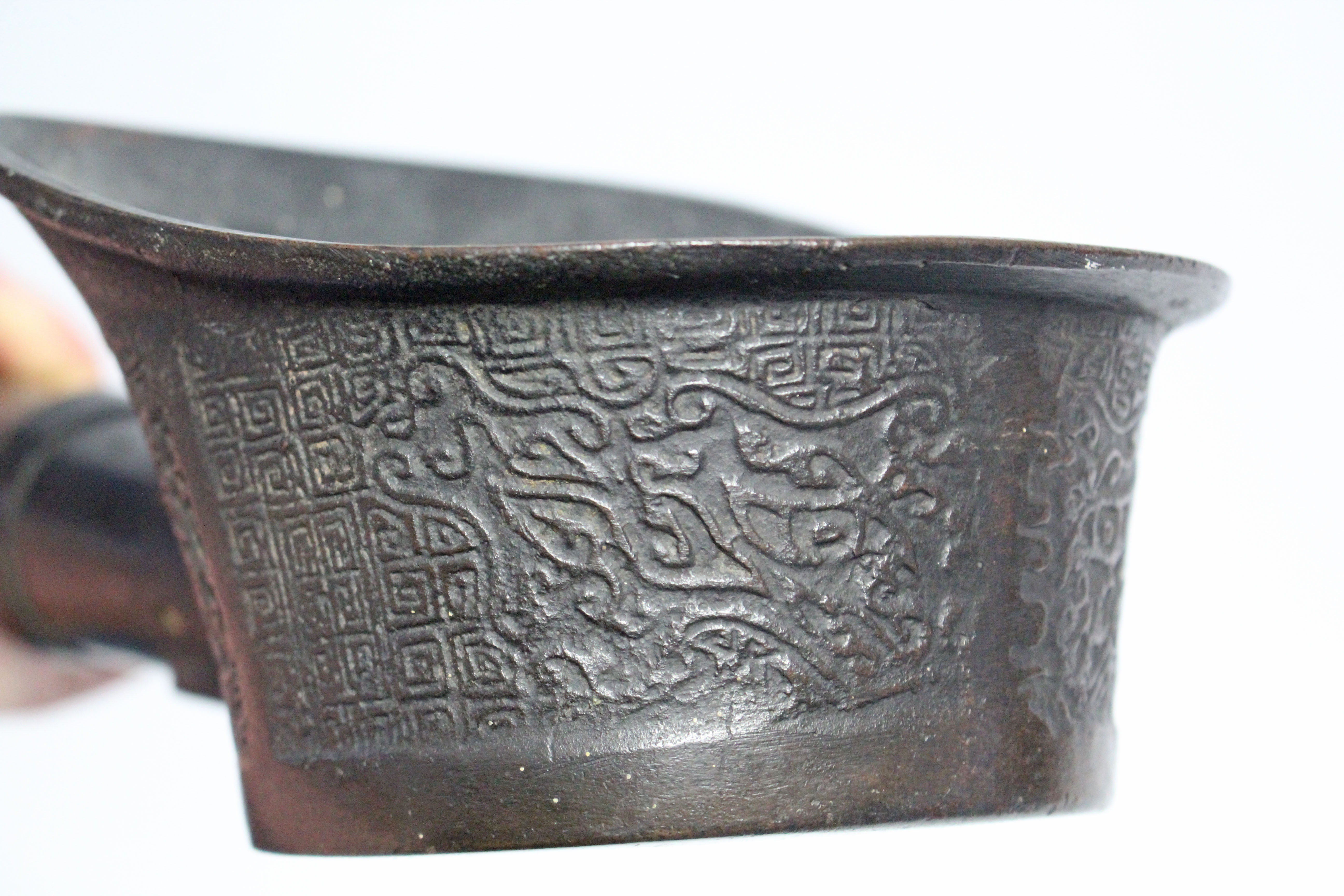 A Chinese archaistic bronze ceremonial ladle with relief decoration on a key-pattern ground, plain - Image 3 of 6