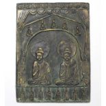 A Chinese relief-decorated bronze plaque depicting Buddhistic deities, with traces of gilt