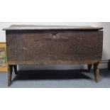 An early 18th century elm coffer of six-plank construction, the lift-lid with moulded edge; 43” wide