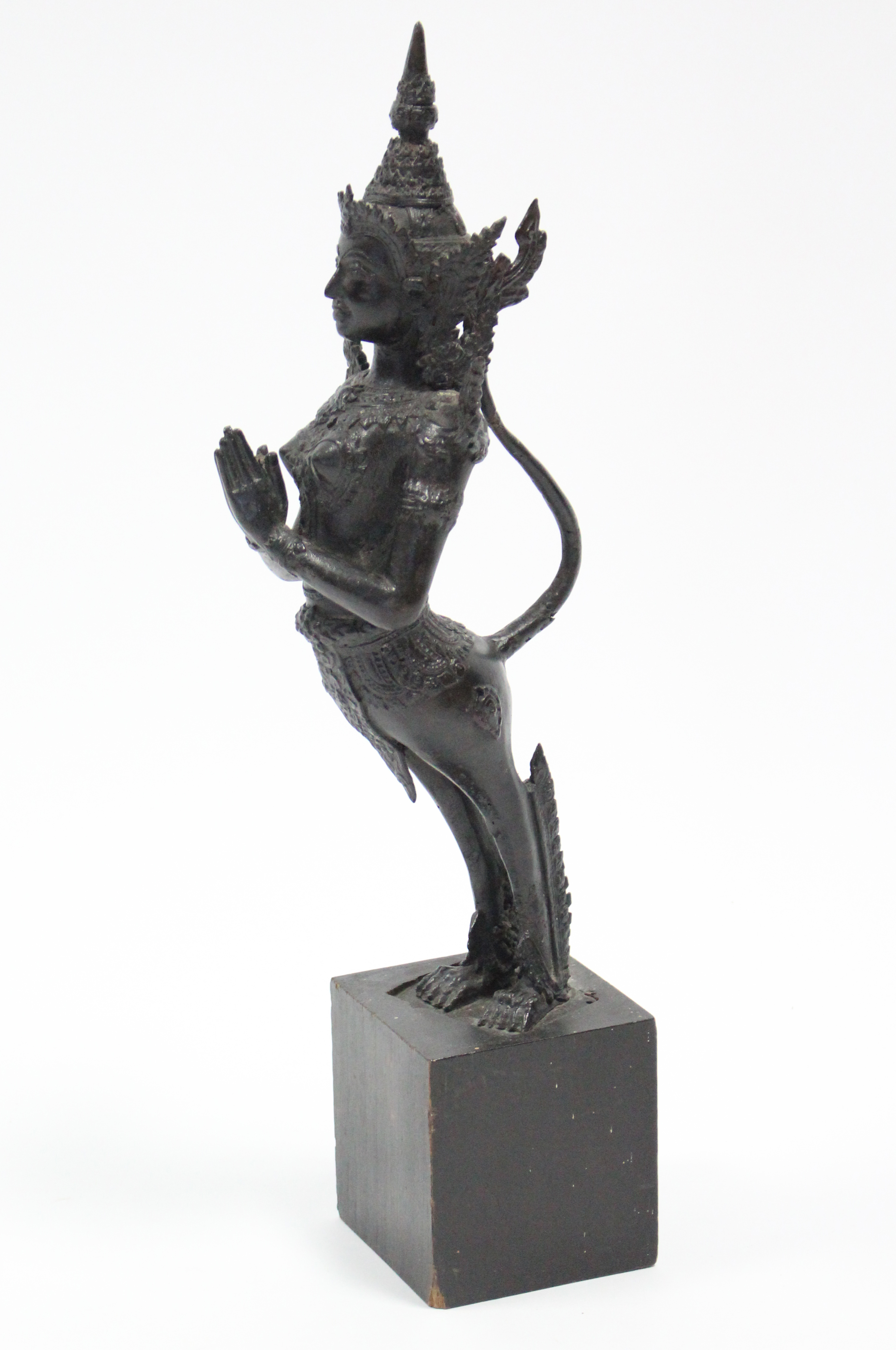 A Thai bronze standing figure of Kinnara with hands in prayer; 15¾” high, on wooden block base. - Image 4 of 5