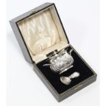 An Edwardian silver two-handled tea caddy of oval semi-fluted form, with removable lid, 4½” wide,