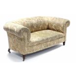A Victorian chesterfield-style sofa & matching armchair, each upholstered printed material with