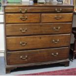 An early 18th century large oak chest, fitted full-width shallow drawer above two short