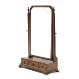 A George I-style walnut swing toilet glass, the rectangular bevelled plate with re-entrant