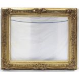 A large 19th century giltwood & gesso picture frame with pierced foliate scroll decoration, 46” x