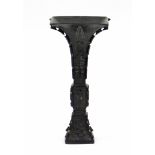 A Chinese archaistic bronze Gu-shaped vase of square section, with notched flanges at the edges, the