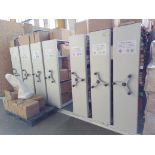 A COMPACT MOBILE ARCHIVE SYSTEM OF SEVEN BAYS, each bay 12’ wide x 76” high x 21” deep.