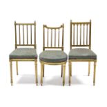 A pair of 19th century gold painted salon chairs with fluted rail-backs, padded seats & on fluted
