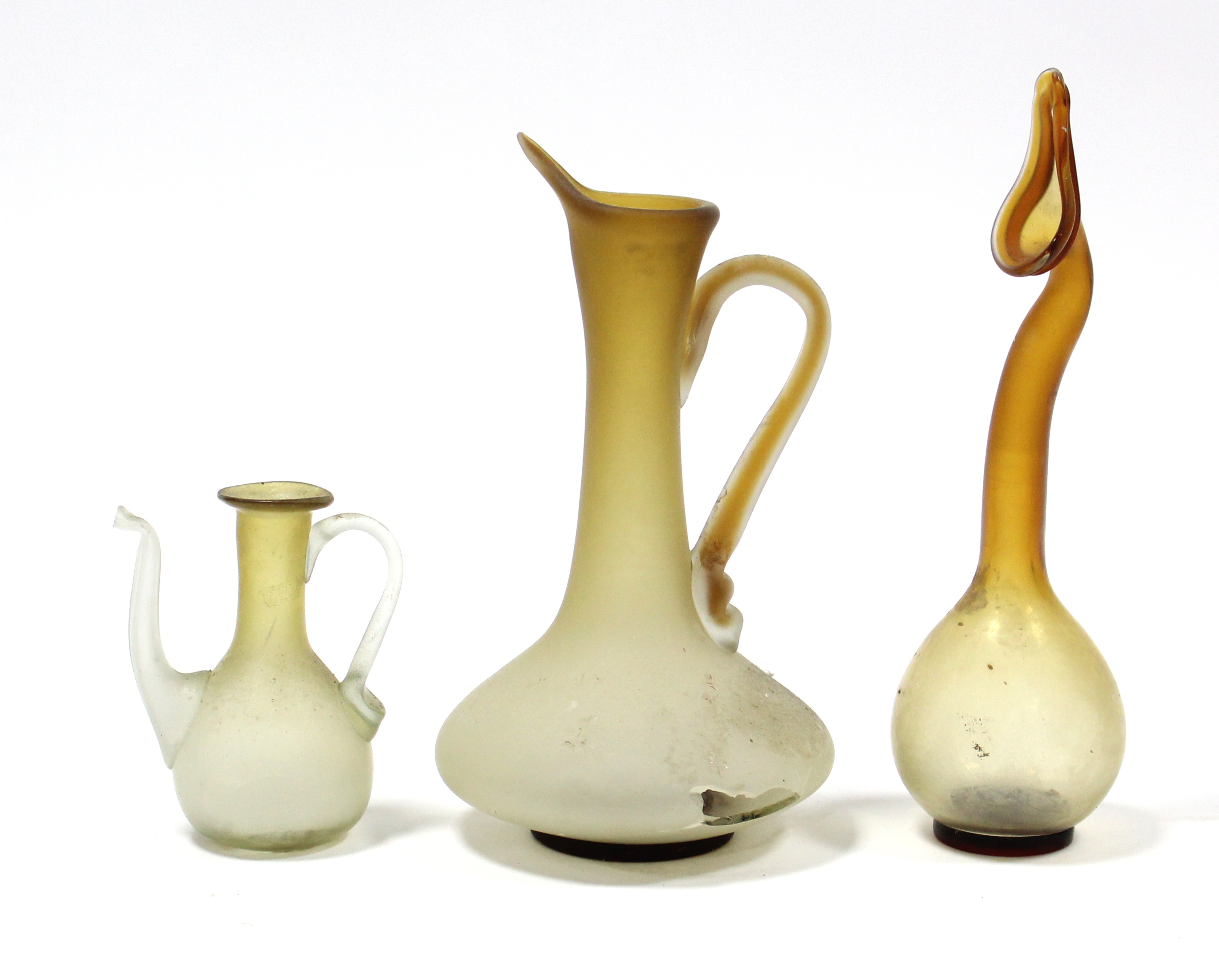 An amber-tinted glass vase with rounded body & tall slender “swan” neck, 12”; & two similar ewers,