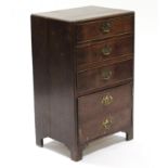 An 18th century style narrow oak chest fitted three drawers with brass swing handles above a
