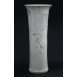 An 18th century Chinese Dehua porcelain tall beaker vase decorated with sprigs of prunus blossom