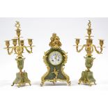 A late 19th century French onyx clock garniture with gilt-metal rococo style mounts, the mantel