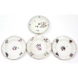 Three 18th century Meissen porcelain plates with moulded floral borders & painted with flowers & a