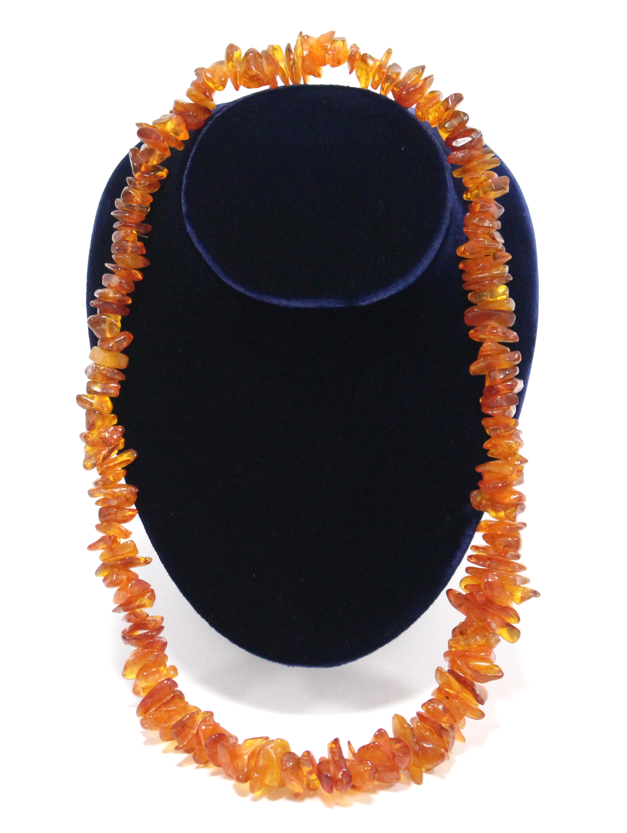A Baltic amber necklace of graduated irregular-shaped segments; approx. 27” long.
