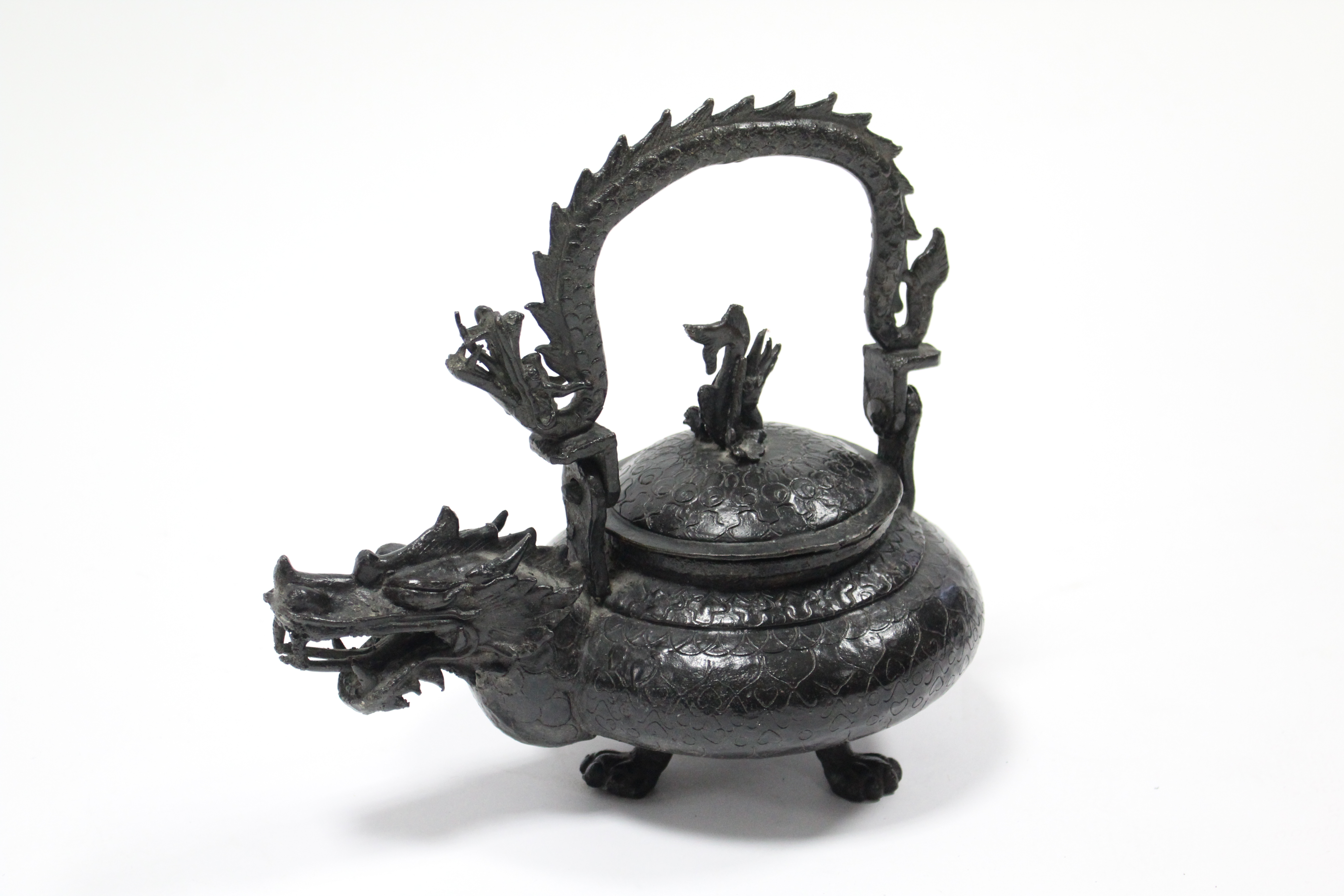 A late 19th century Chinese bronze teapot with squat round body, dragon spout & swing handle in - Image 2 of 4