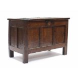 A late 17th century joined oak triple-panel coffer, with hinged lift-lid, & on stump feet; 41¼” wide