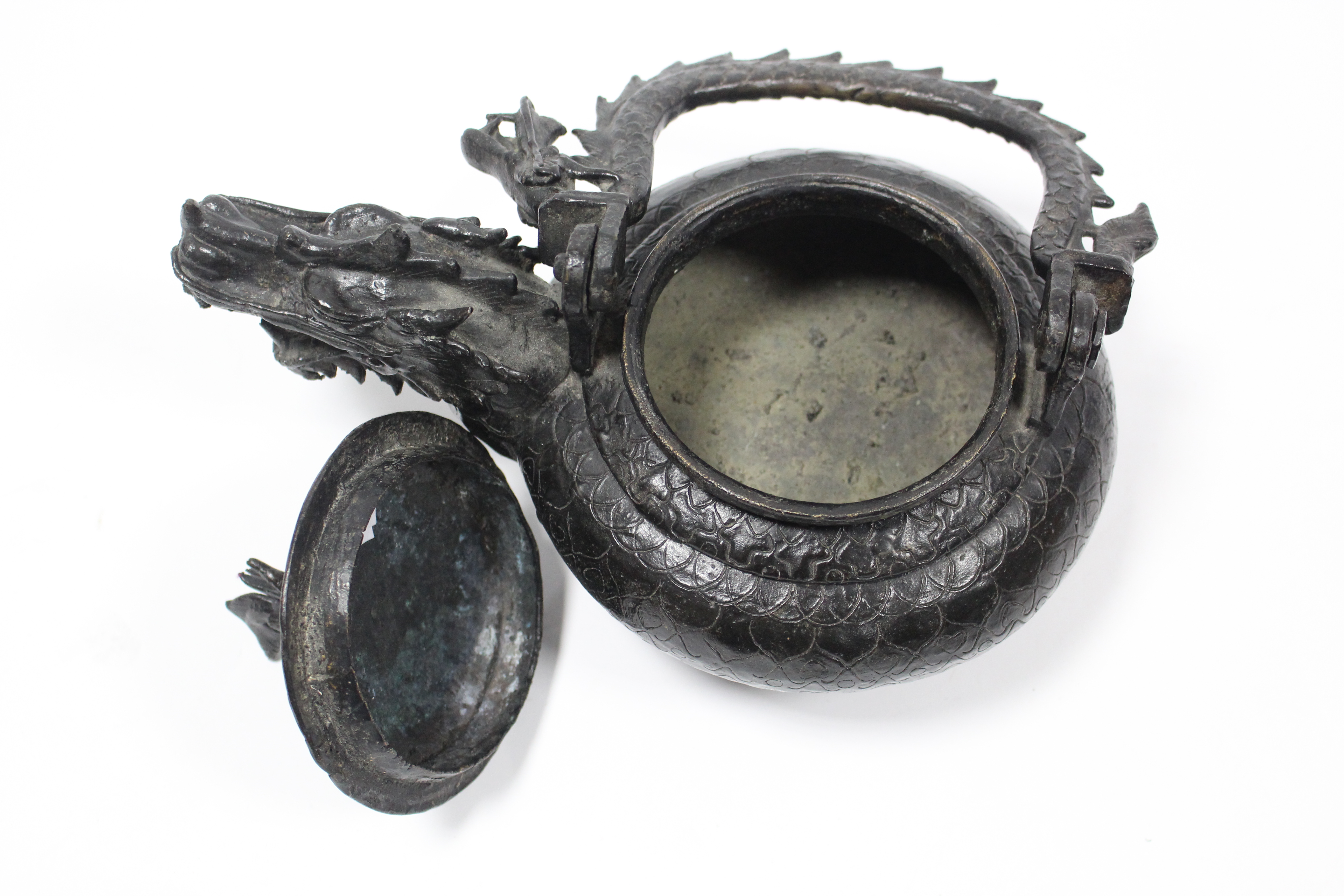 A late 19th century Chinese bronze teapot with squat round body, dragon spout & swing handle in - Image 3 of 4