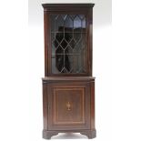 A 19th century inlaid-mahogany standing corner display cabinet with dentil cornice, fitted two