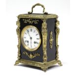 A 19th century French mantel clock, the 3½” white enamel dial with roman numerals, in ebonised