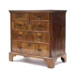 An 18th century figured walnut veneered chest, fitted two short & three long graduated drawers