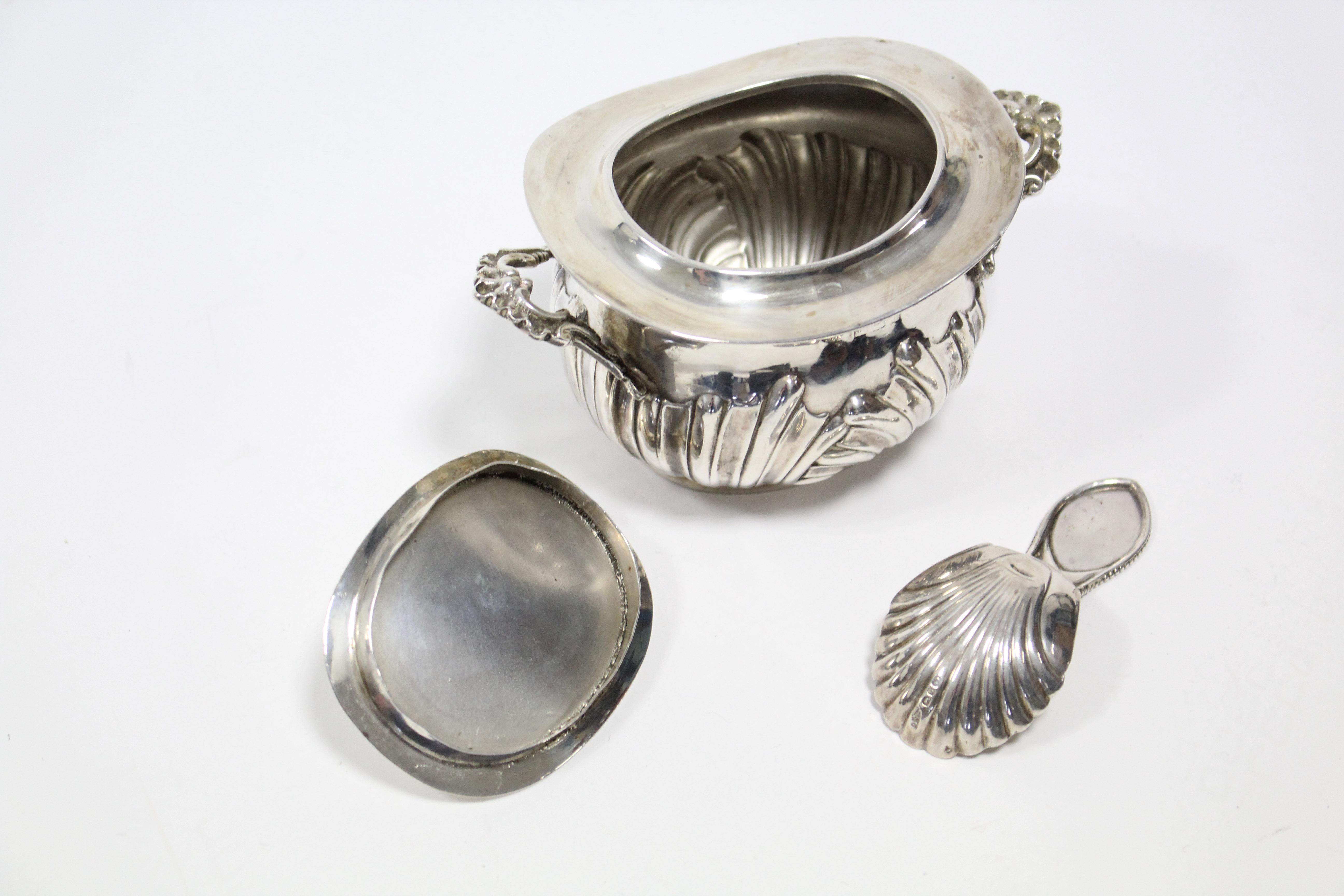 An Edwardian silver two-handled tea caddy of oval semi-fluted form, with removable lid, 4½” wide, - Image 3 of 4