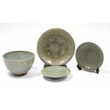 An early Chinese celadon-ground shallow dish with crackle glaze, 12¼” diam. (some glaze flaking to