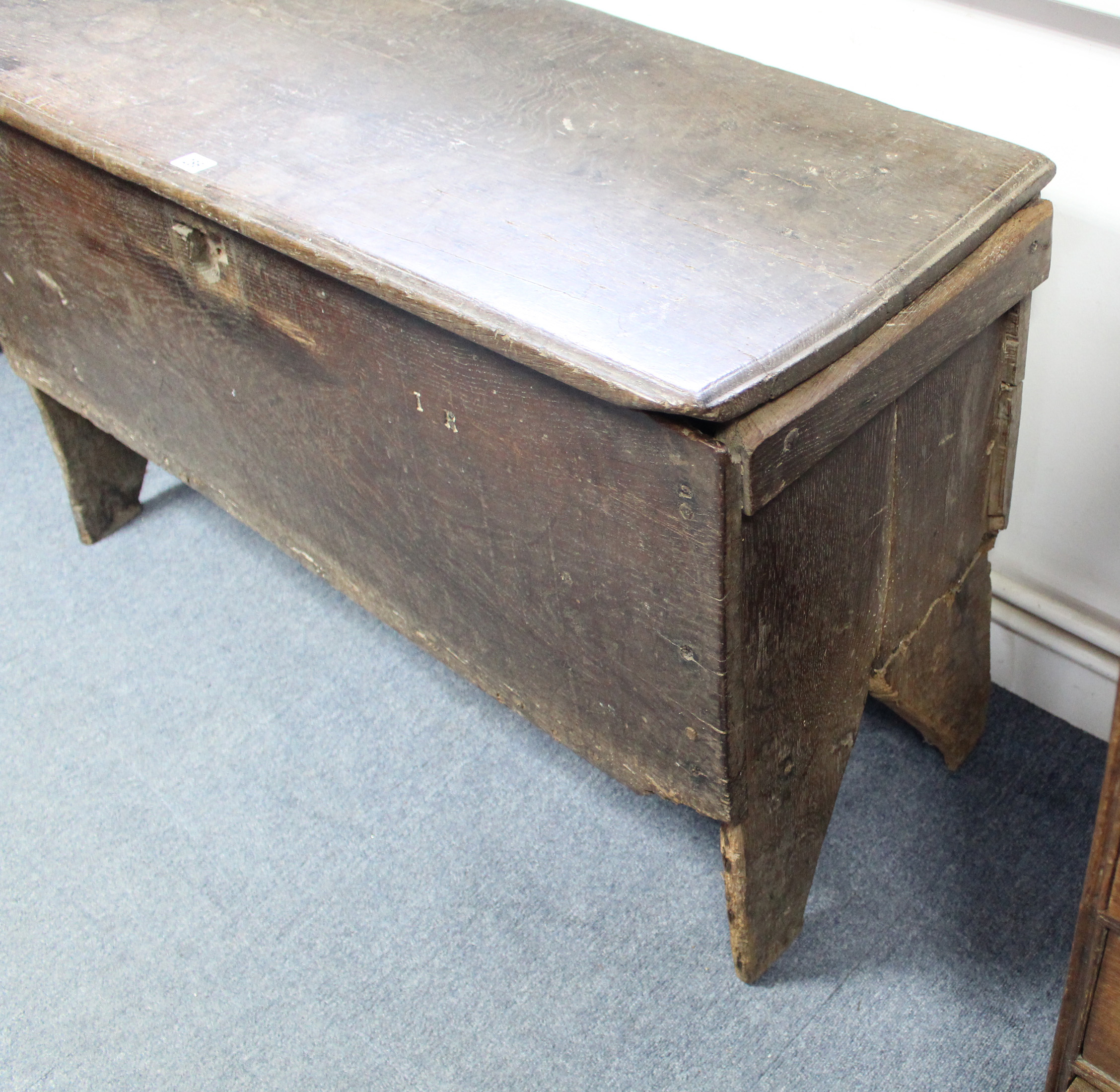 An early 18th century elm coffer of six-plank construction, the lift-lid with moulded edge; 43” wide - Image 2 of 5