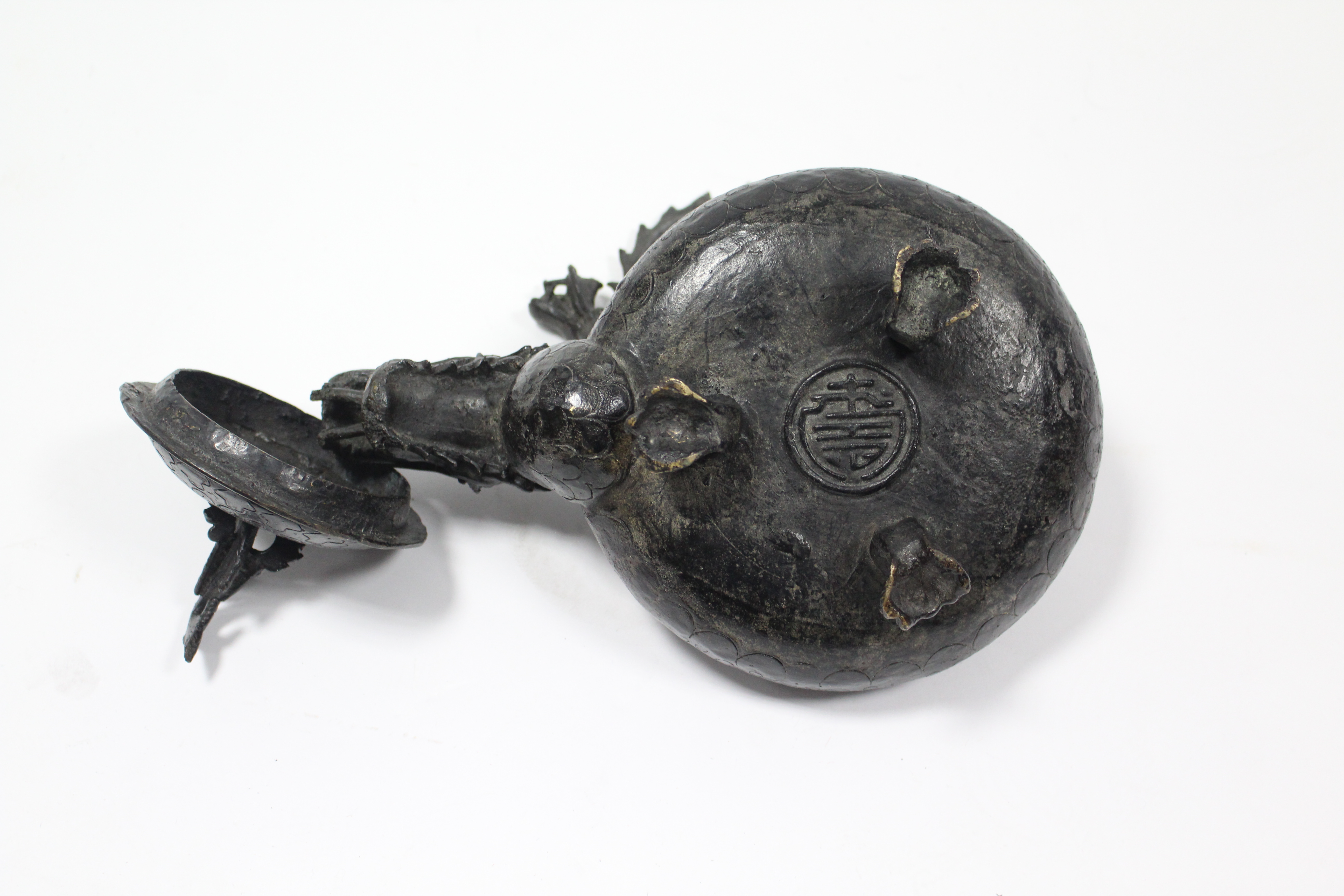 A late 19th century Chinese bronze teapot with squat round body, dragon spout & swing handle in - Image 4 of 4