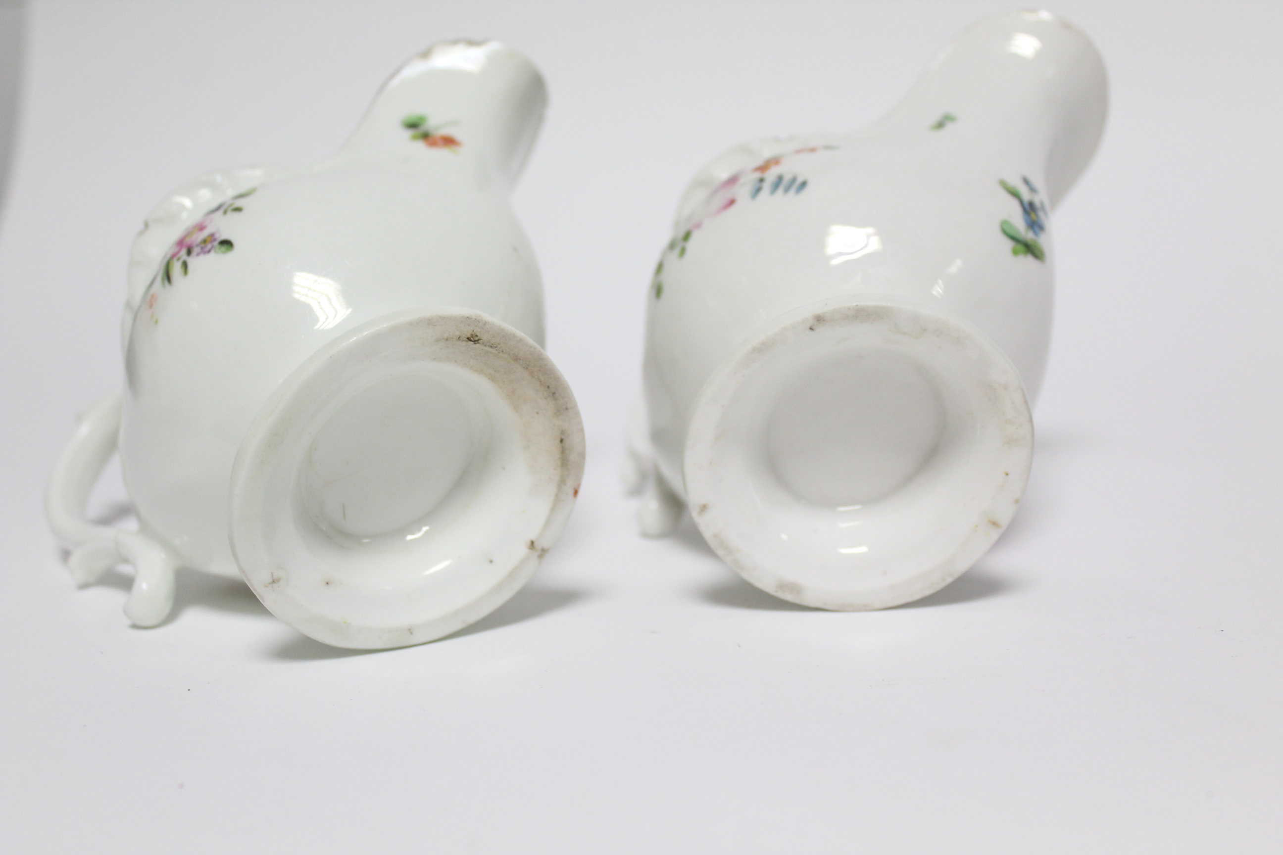 A pair of 18th century Derby porcelain sauce boats, each of moulded shell form with scroll - Image 2 of 2