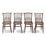 A set of four late Victorian beech café chairs with turned spindle backs & floral design poker-