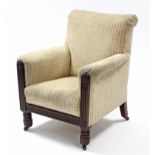 A William IV armchair, the padded seat, back & arms upholstered brass-studded cram & gold fabric,
